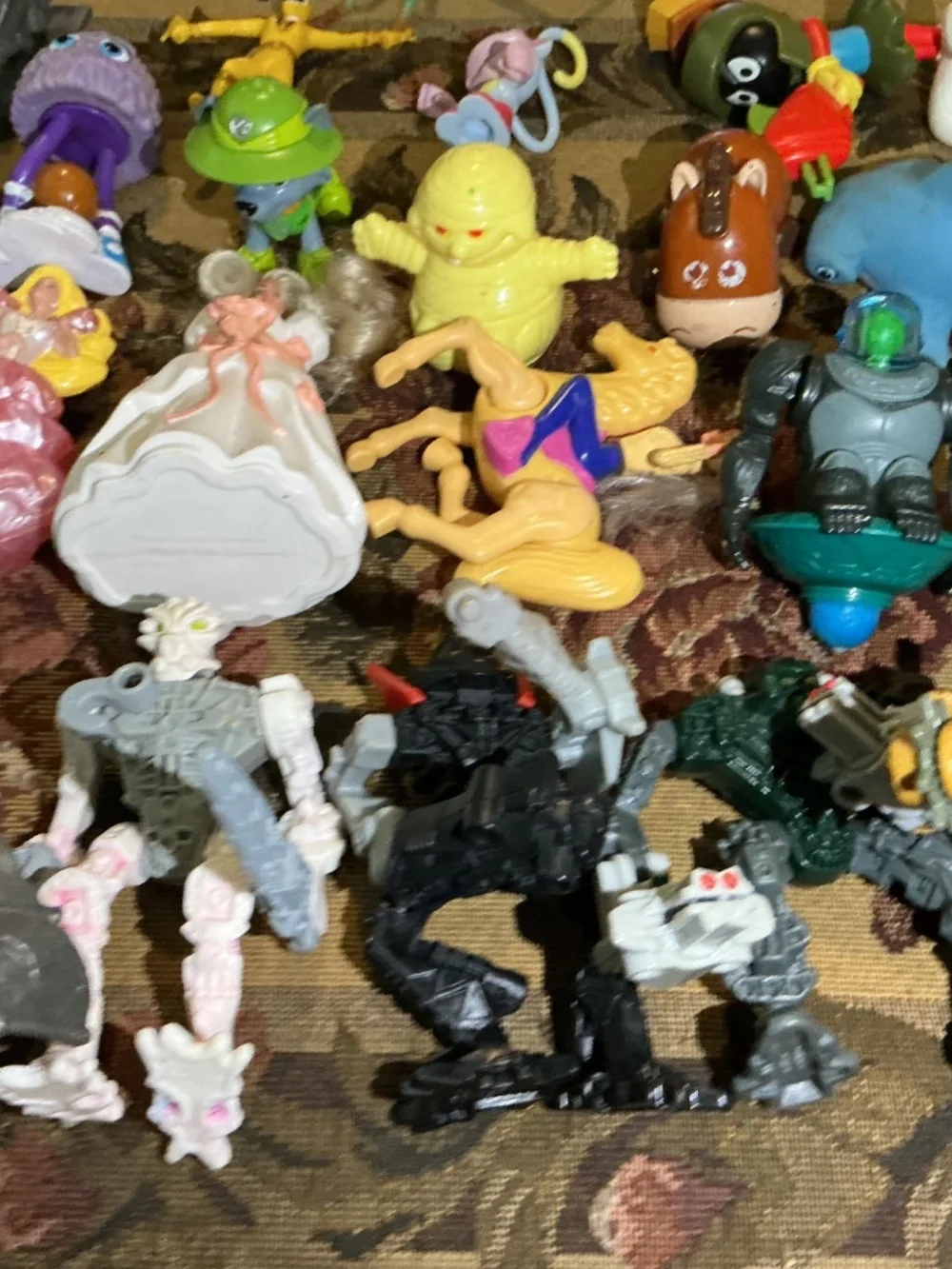 32 Miscellaneous small Toy lot with NBA Bionicle looney tune barbie and more